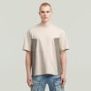 A-linjeformad vävd mix-t-shirt med boxig passform