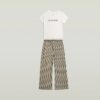 Pyjamasset med t-shirt och vida byxor Pyjamasset med t-shirt och vida byxor