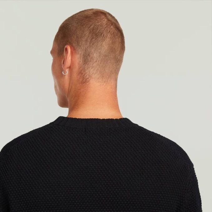 Stickad med honungskamstruktur Stickad med honungskamstruktur