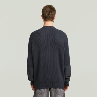 Stickad pullover i vävd blandning