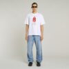 T-shirt med boxigt tryck och arkivtryck