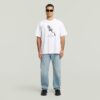 T-shirt med boxigt tryck och arkivtryck