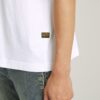 T-shirt med boxigt tryck och arkivtryck