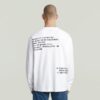 T-shirt med broderad text baktill