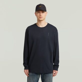 T-shirt med broderad text baktill