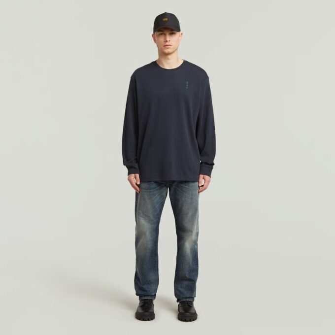 T-shirt med broderad text baktill