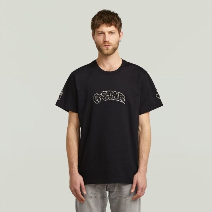 T-shirt med lappar och lös passform T-shirt med lappar och lös passform