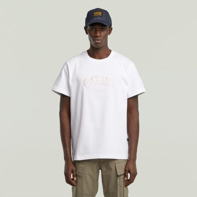 T-shirt med lappar och lös passform T-shirt med lappar och lös passform