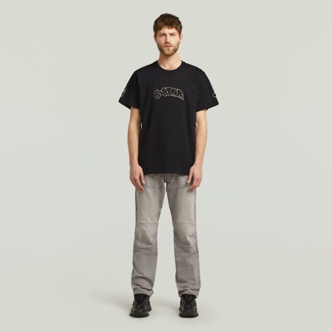 T-shirt med lappar och lös passform T-shirt med lappar och lös passform