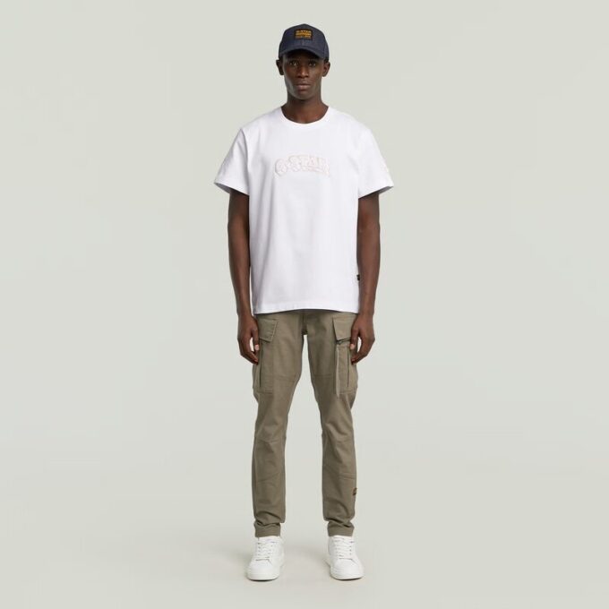 T-shirt med lappar och lös passform T-shirt med lappar och lös passform