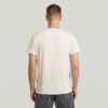 T-shirt med sliten logotyp och grafik