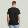 T-shirt med sliten logotyp och grafik T-shirt med sliten logotyp och grafik