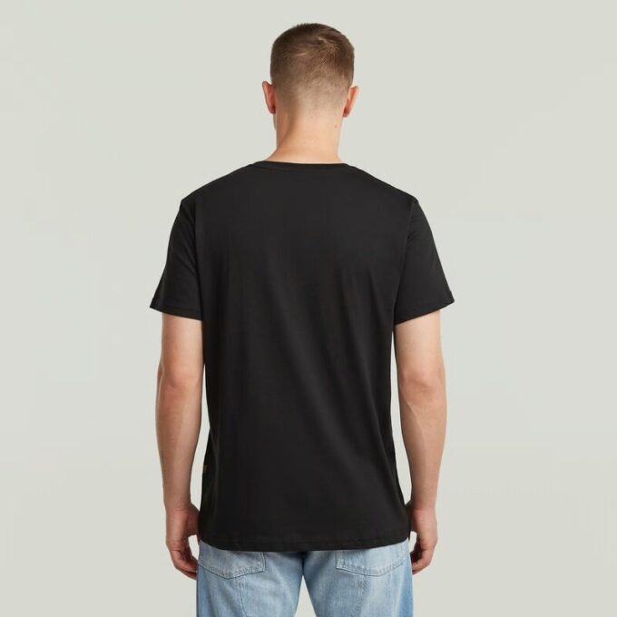T-shirt med sliten logotyp och grafik T-shirt med sliten logotyp och grafik