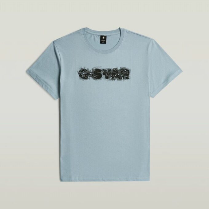 T-shirt med sliten logotyp och grafik T-shirt med sliten logotyp och grafik