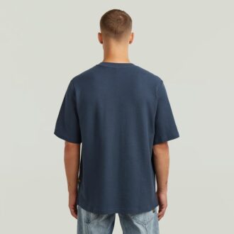 T-shirt med strukturerad logotyp på bröstet