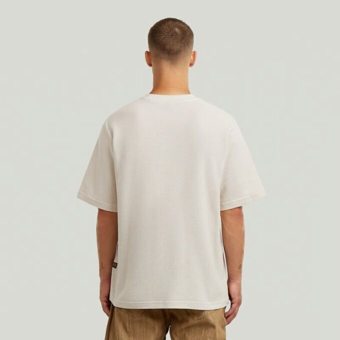 T-shirt med strukturerad logotyp på bröstet