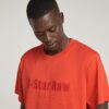 T-shirt med symboltryck och lös passform
