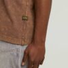 T-shirt med tvättad ficka