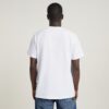 Unisex jeans-t-shirt med tecknad lös passform Unisex jeans-t-shirt med tecknad lös passform