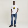Unisex jeans-t-shirt med tecknad lös passform Unisex jeans-t-shirt med tecknad lös passform