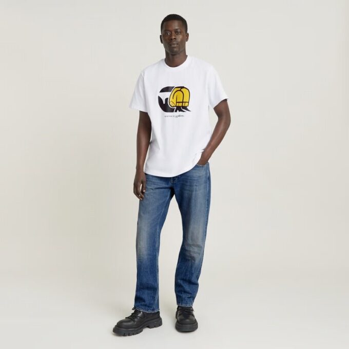 Unisex jeans-t-shirt med tecknad lös passform Unisex jeans-t-shirt med tecknad lös passform